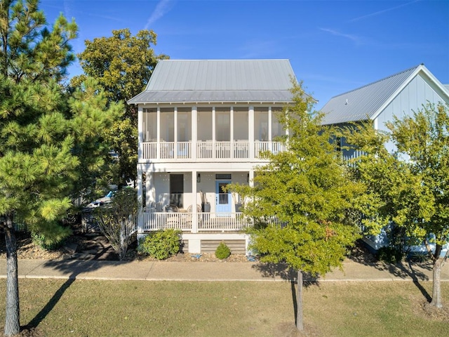 view of front of home with a sunroom