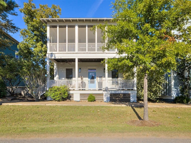 view of front of house with a front lawn and a porch