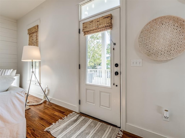 doorway to outside with dark wood-type flooring