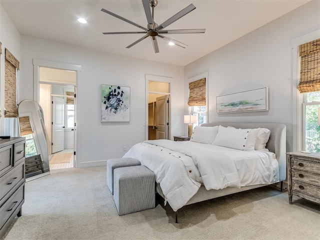 bedroom featuring ceiling fan and light colored carpet