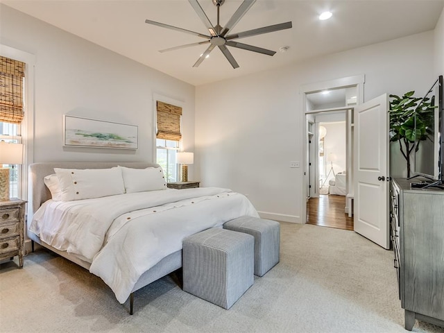 carpeted bedroom featuring ceiling fan