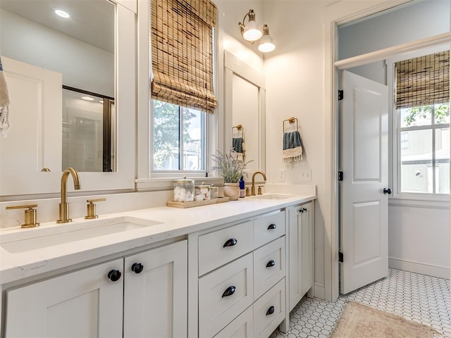 bathroom featuring tile patterned flooring and vanity