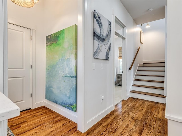 stairway featuring hardwood / wood-style floors