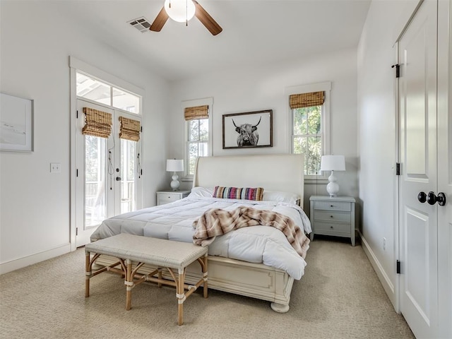 bedroom featuring ceiling fan, light carpet, and access to outside