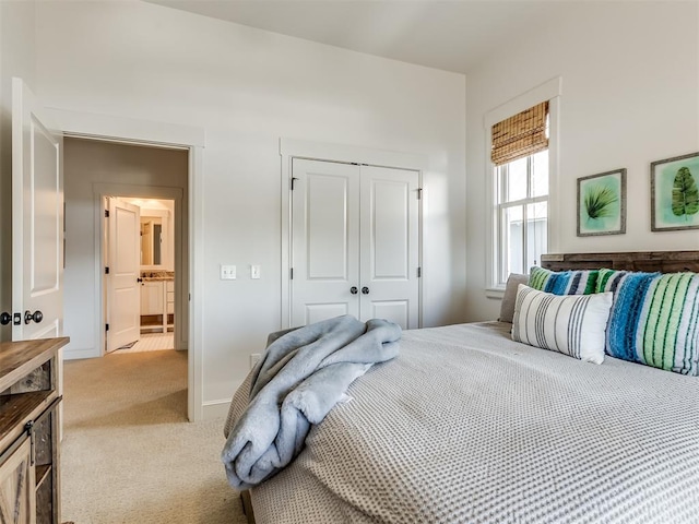 carpeted bedroom with a closet