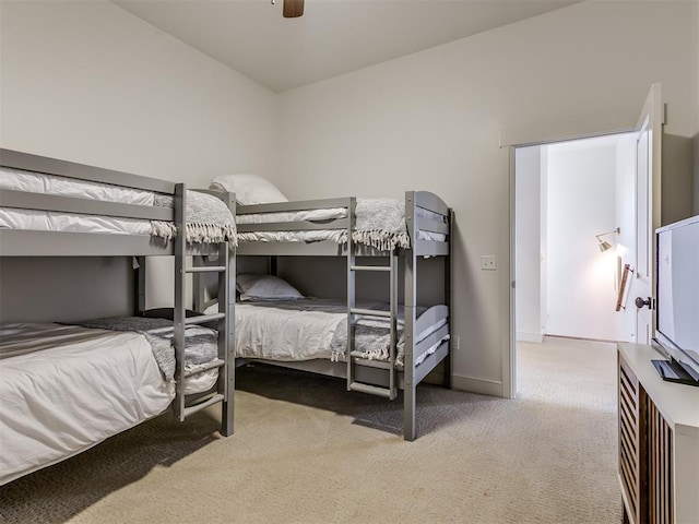 bedroom featuring ceiling fan, carpet, and vaulted ceiling