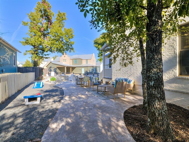 exterior space with outdoor lounge area and a patio area