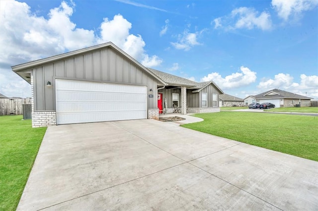 ranch-style house with board and batten siding, a front yard, driveway, and an attached garage