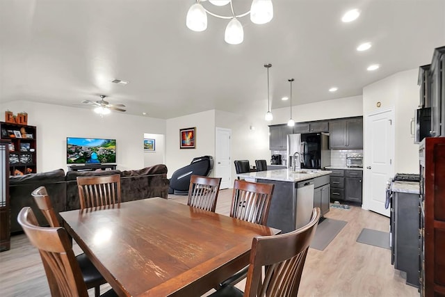 dining space with a toaster, light wood finished floors, recessed lighting, visible vents, and a ceiling fan