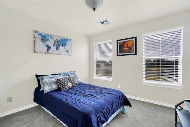 bedroom featuring carpet flooring, visible vents, and baseboards