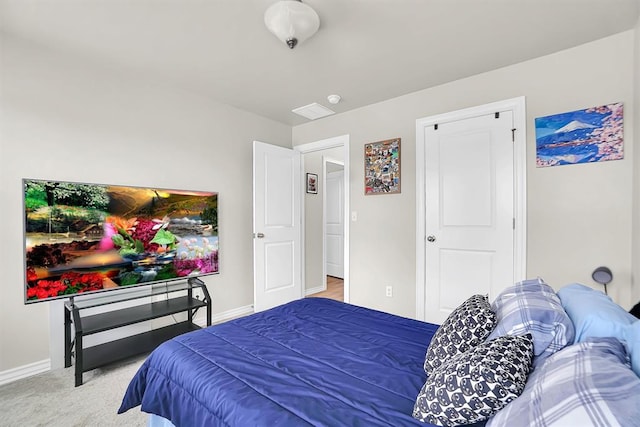 bedroom with baseboards and carpet flooring