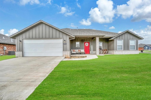 single story home featuring an attached garage, a front lawn, board and batten siding, and concrete driveway