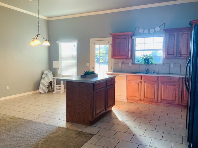 kitchen with backsplash, black fridge, white dishwasher, light tile patterned floors, and a kitchen island