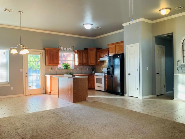 kitchen featuring black fridge, a center island, light carpet, and white stove