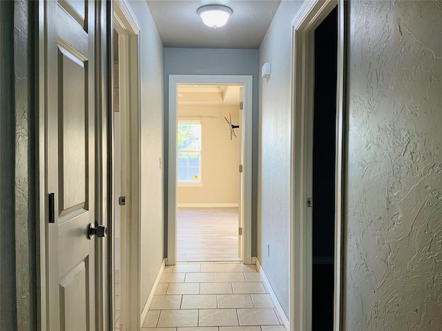 hallway with light tile patterned flooring