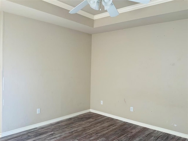 unfurnished room with ceiling fan, crown molding, and dark wood-type flooring