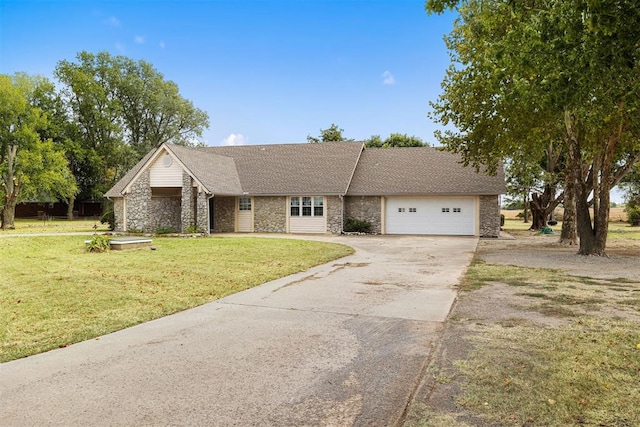 single story home featuring a front yard and a garage