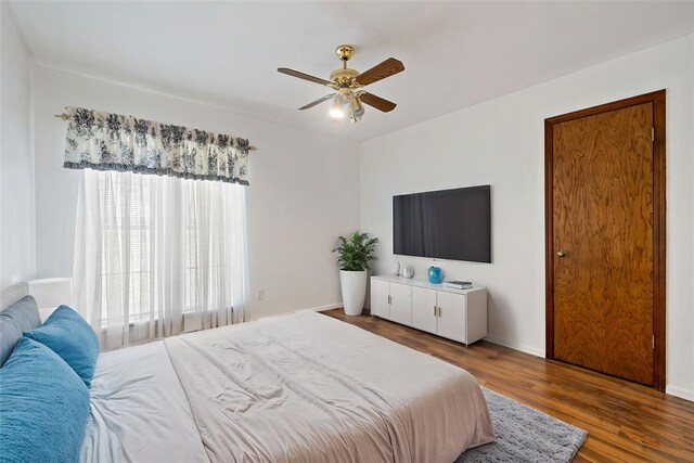 bedroom with hardwood / wood-style flooring and ceiling fan