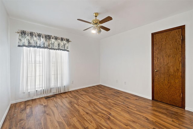 unfurnished room featuring hardwood / wood-style flooring and ceiling fan