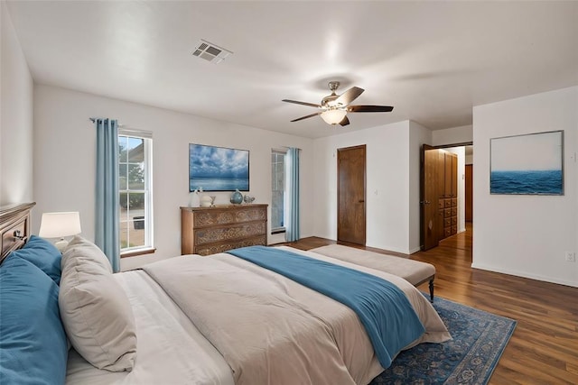 bedroom featuring ceiling fan and dark wood-type flooring