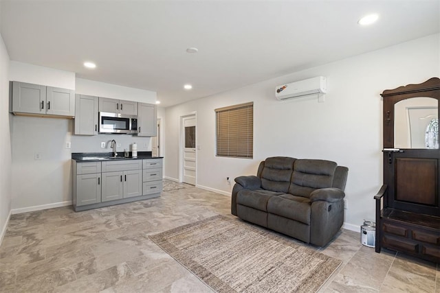 living room with sink and a wall mounted AC