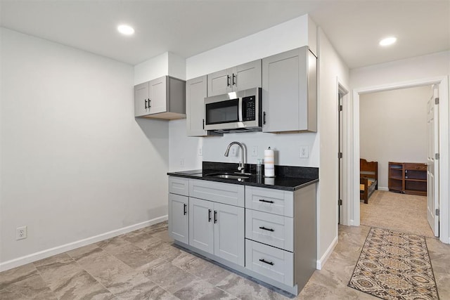 kitchen featuring gray cabinets and sink