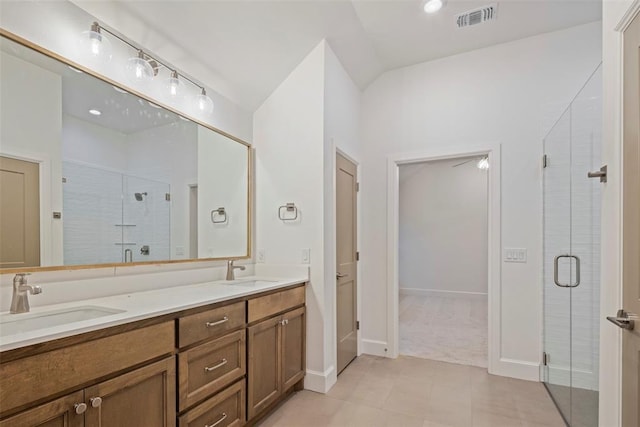 bathroom with vanity and an enclosed shower