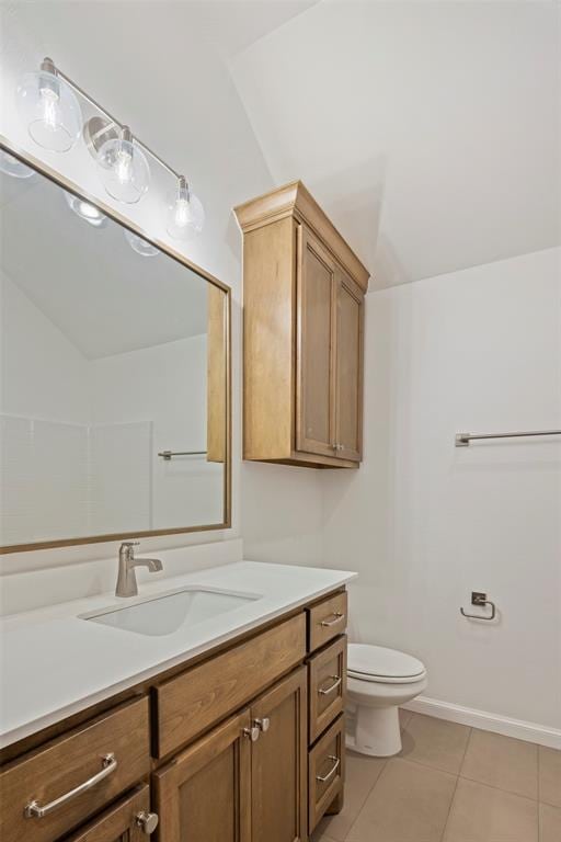 bathroom featuring tile patterned floors, toilet, and vanity