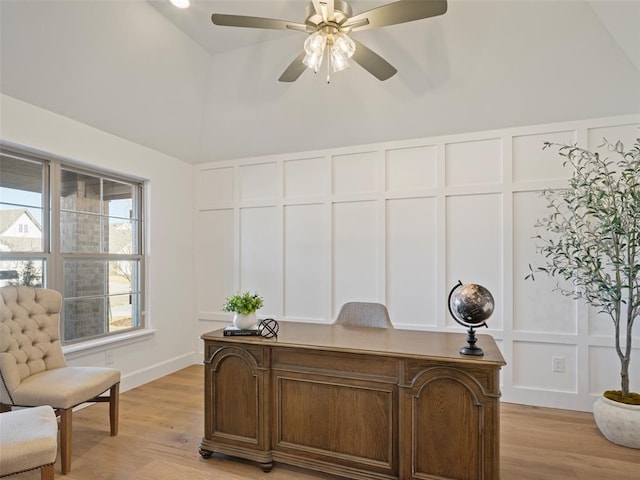 home office featuring ceiling fan, lofted ceiling, and light hardwood / wood-style flooring