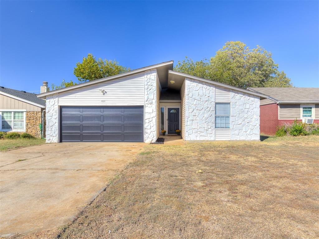 ranch-style home featuring a garage