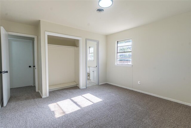 3201 Longridge Rd, Del City, OK 73115 - unfurnished bedroom with carpet, a closet, and connected bathroom