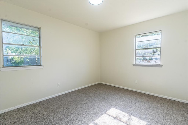 3201 Longridge Rd, Del City, OK 73115 - empty room featuring carpet and healthy amount of natural light