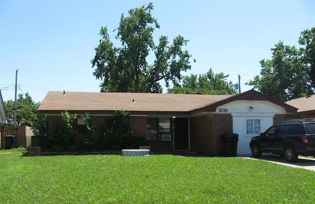 ranch-style home with a front lawn