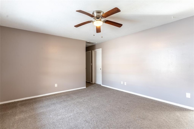 carpeted empty room with ceiling fan