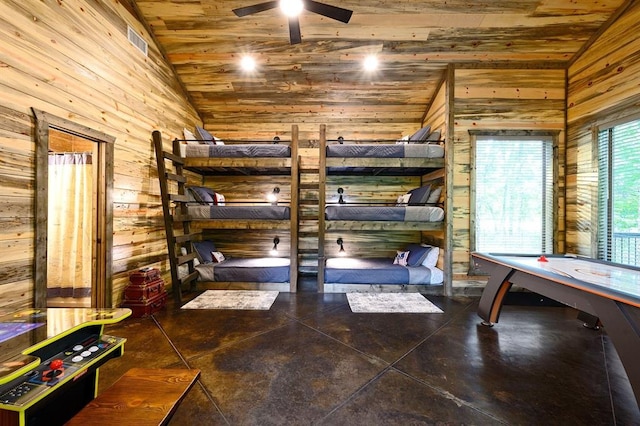 unfurnished bedroom with lofted ceiling, dark tile patterned floors, wood ceiling, and wood walls