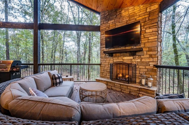 exterior space with wooden ceiling and an outdoor stone fireplace