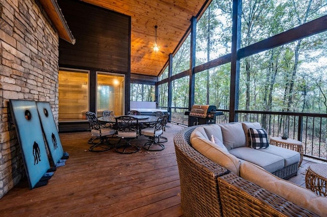 sunroom / solarium featuring wooden ceiling, lofted ceiling, and plenty of natural light