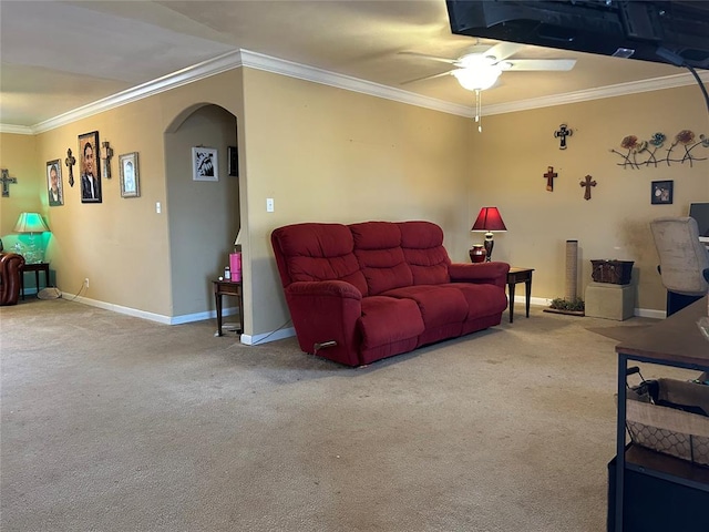 living room featuring carpet, ceiling fan, and crown molding