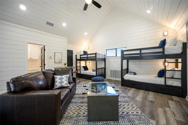 bedroom featuring wooden ceiling, dark wood-type flooring, high vaulted ceiling, wooden walls, and ceiling fan