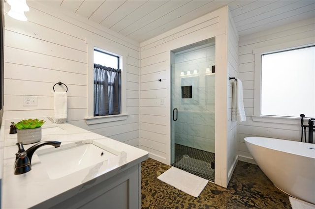 bathroom featuring plus walk in shower, vanity, and wood walls