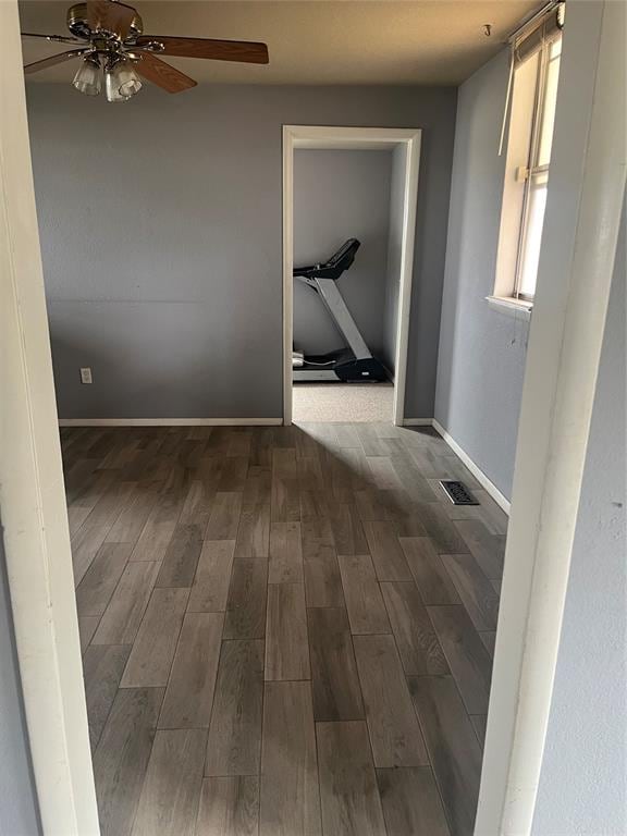 corridor featuring dark hardwood / wood-style flooring