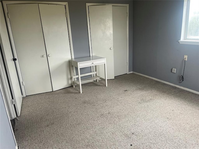 unfurnished bedroom with carpet and a closet