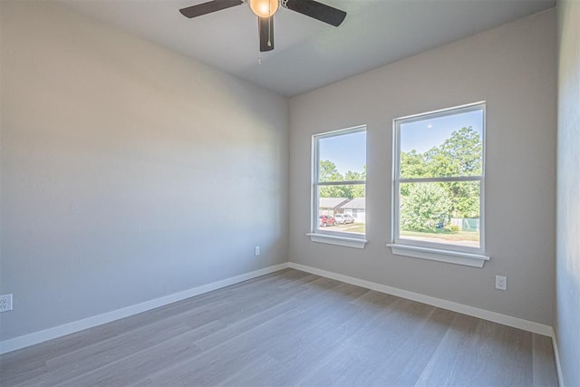 unfurnished room with wood-type flooring and ceiling fan