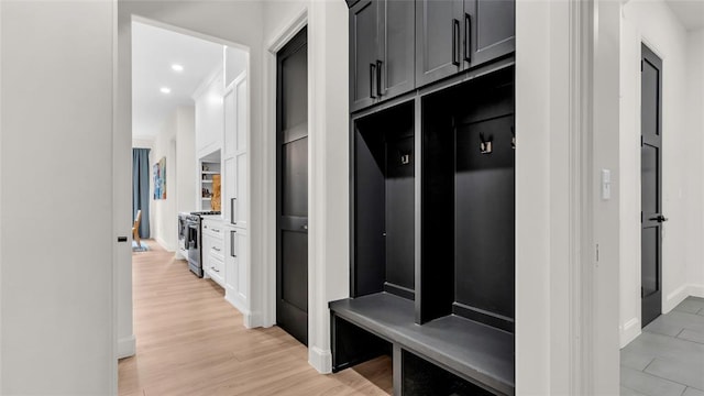 mudroom with light hardwood / wood-style floors