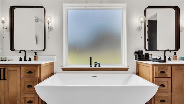 bathroom with vanity and a bathtub