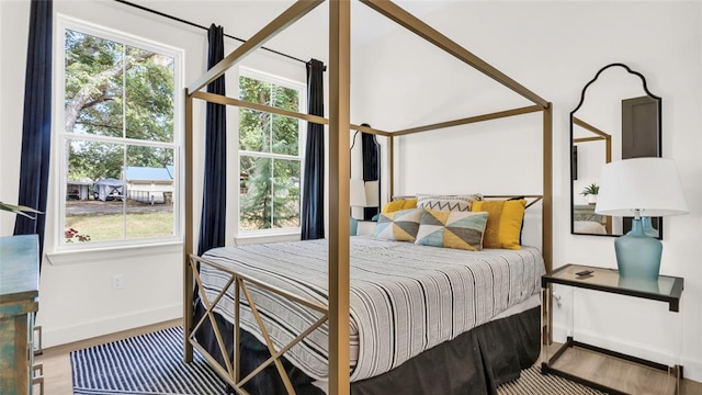 bedroom with hardwood / wood-style floors