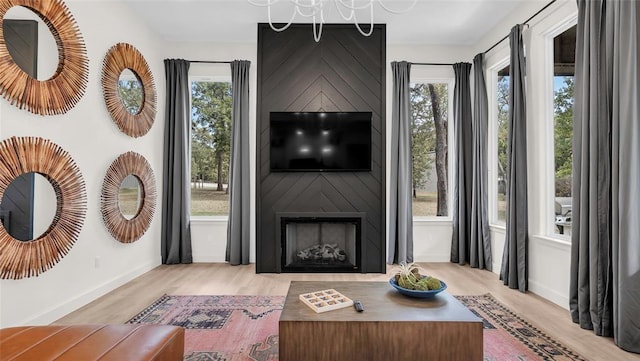 living room with a fireplace and a healthy amount of sunlight