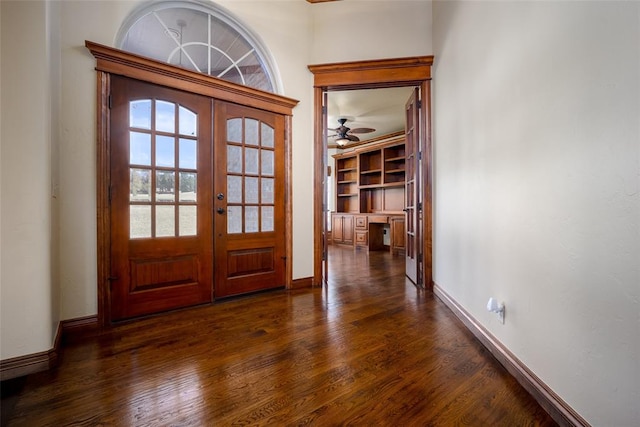 entrance foyer with dark hardwood / wood-style floors, ceiling fan, and french doors