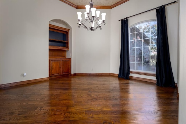 unfurnished dining area with a notable chandelier, dark hardwood / wood-style flooring, and ornamental molding