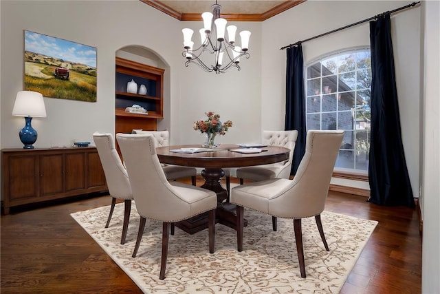 dining room with a chandelier, dark hardwood / wood-style floors, and crown molding